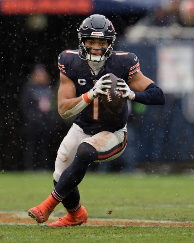 Dec 31, 2023; Chicago, Illinois, USA; Chicago Bears quarterback Justin Fields (1) runs with the ball against the Atlanta Falcons at Soldier Field.